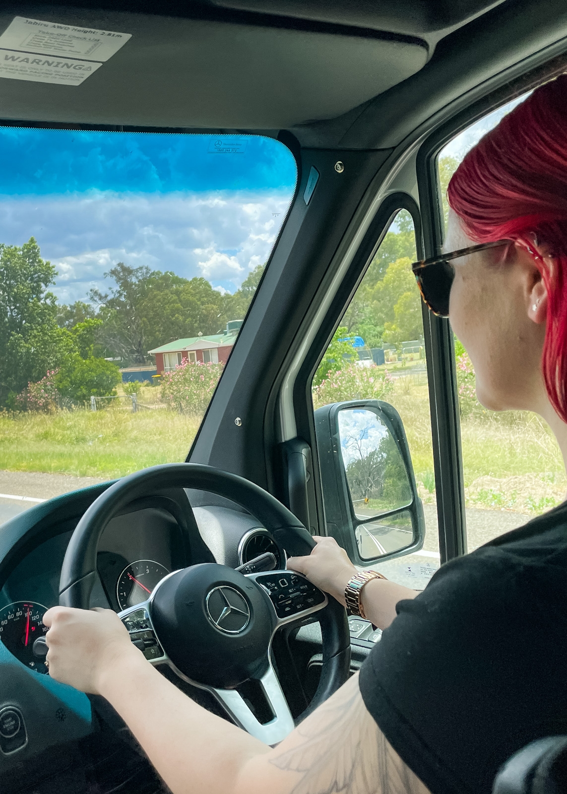 Stephanie driving the Trakka in regional Victoria